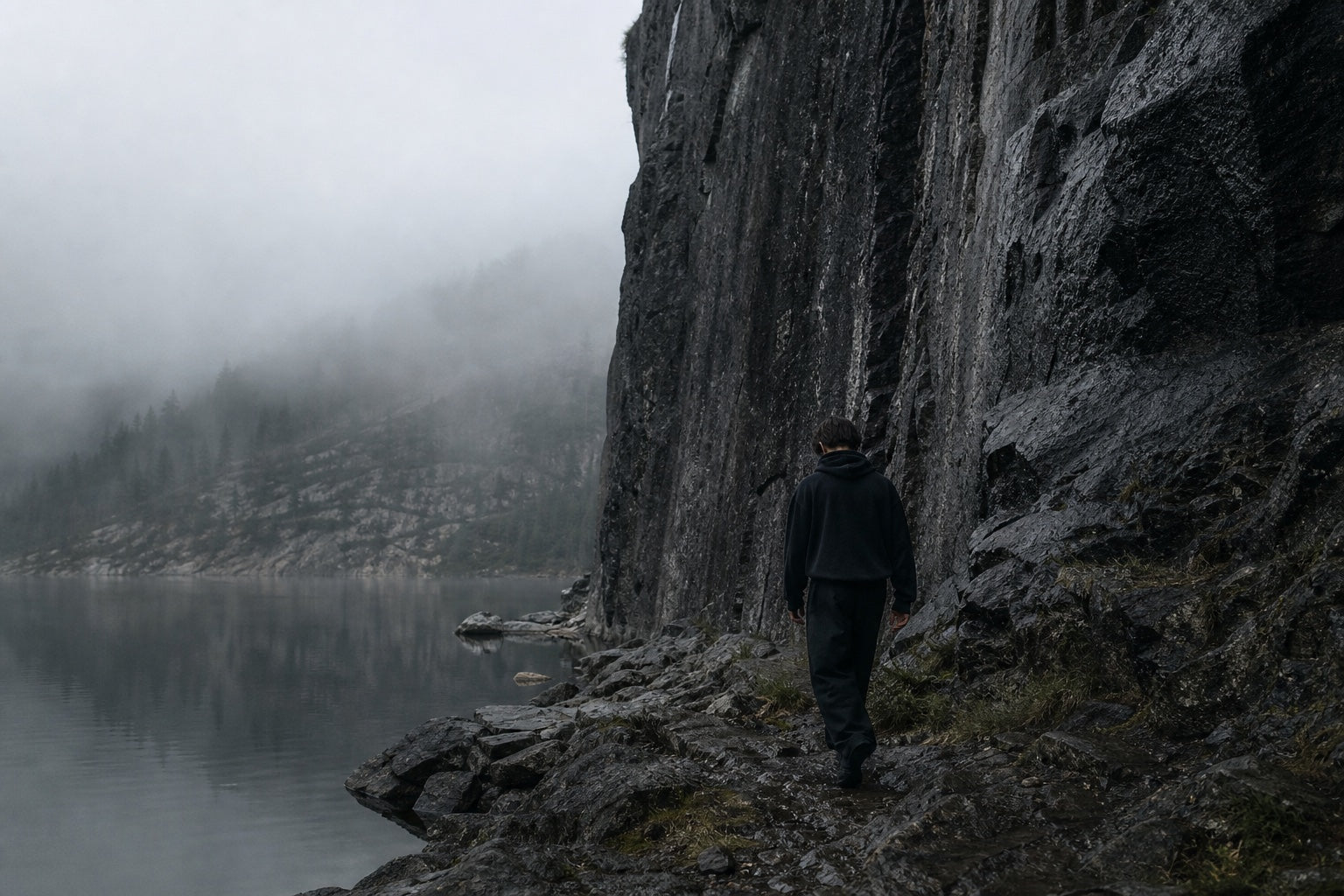 VEYR campaign — solitary figure along a misted stone shore