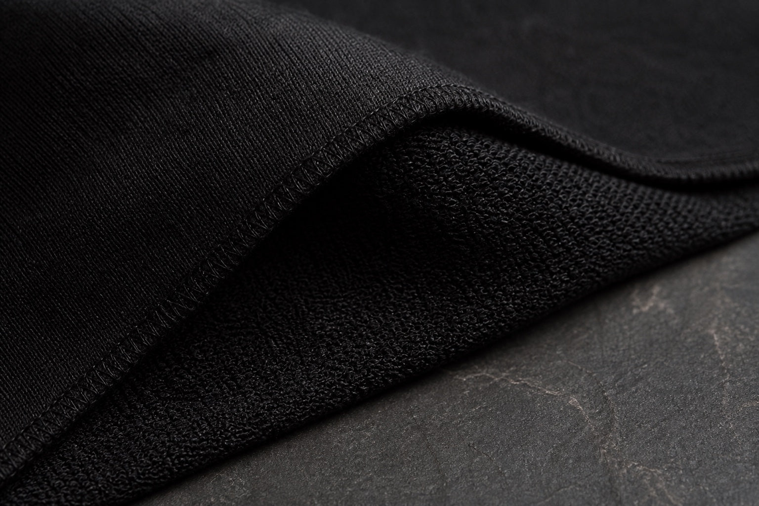 Close detail of black VEYR cotton and stitching